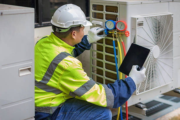 Professional Air Duct Cleaning technician working in Baxter, IA